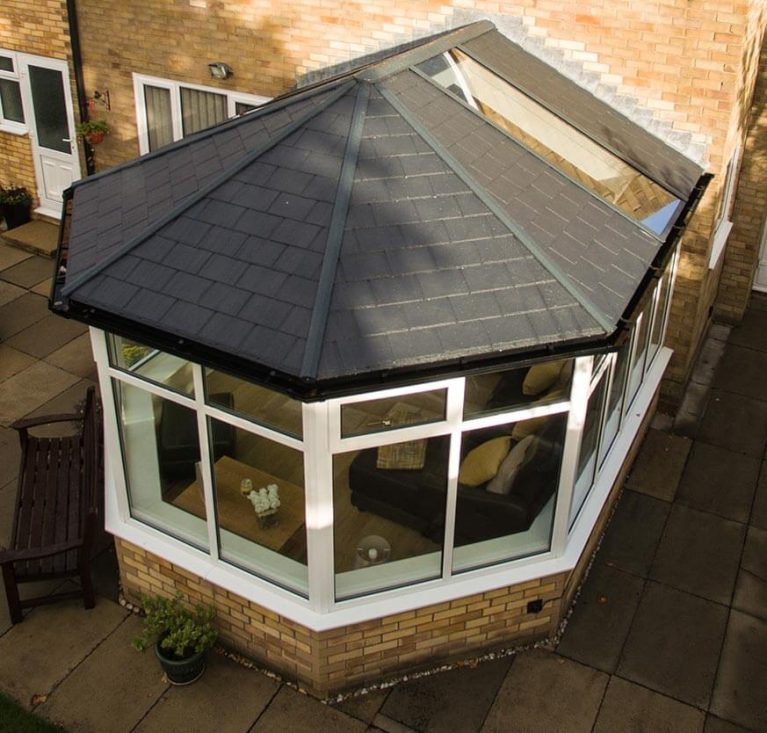 A conservatory installation with a tiled roof