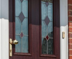 Rosewood diamond lead UPVC entrance door with pad style handle.